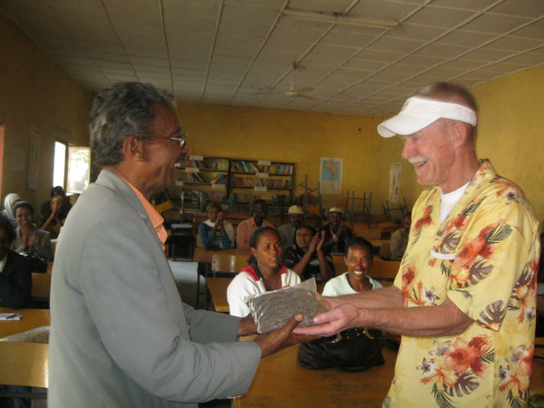 Volunteer Doug Johnson receives gift from host in Ethiopia