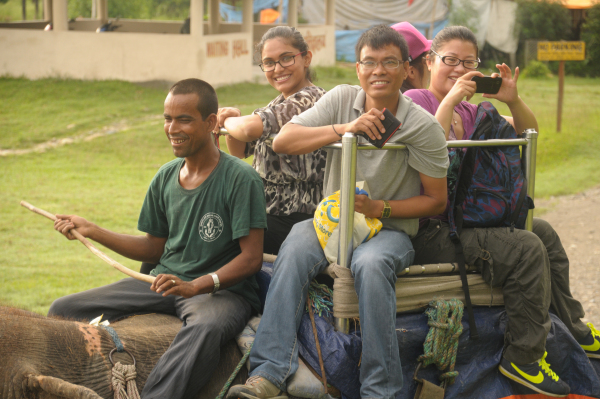 Dr. Saluna Pokhrel (left front) and Mr. Chhan Bahadur Bhattachan (right front) astride an elephant adventure in Chitwan National Par