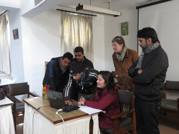Trainees hard at work, under the guidance of volunteer Susan Pavlin