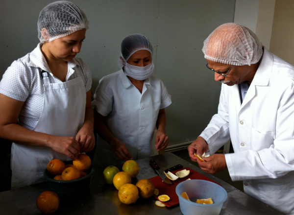 Volunteer Ramana Govin provides food process training to Salvadorian small business